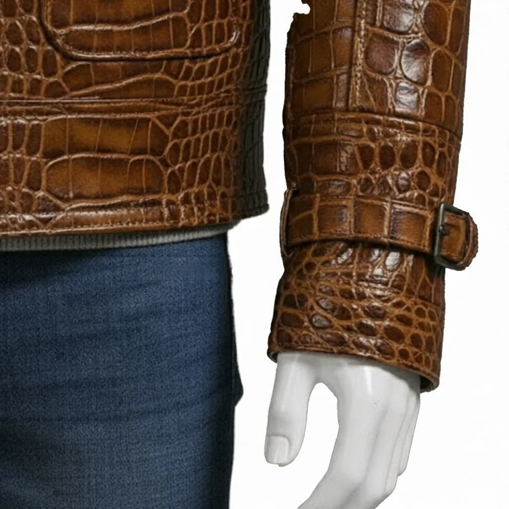 Brown crocodile-patterned leather jacket on a mannequin arm