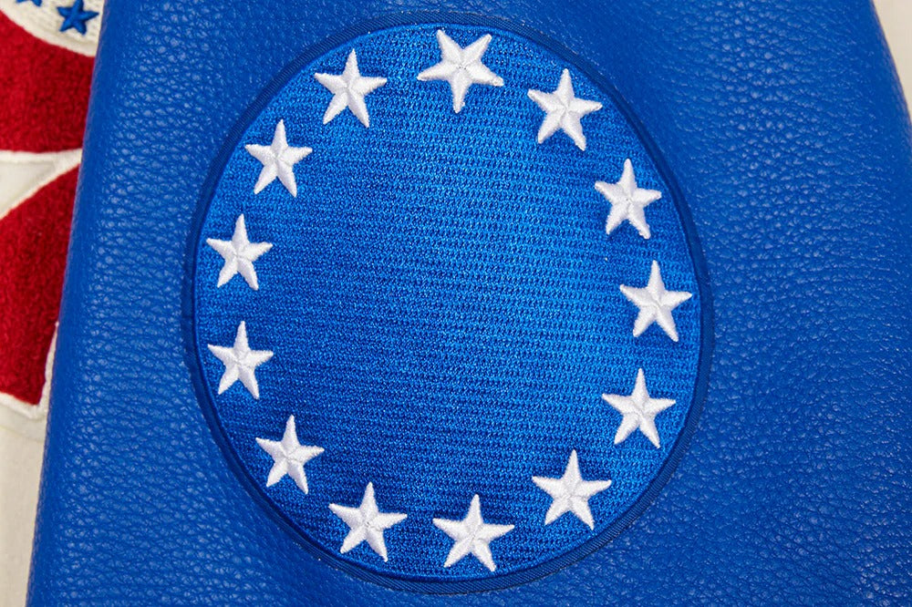 Blue patch with white stars on a textured blue background
